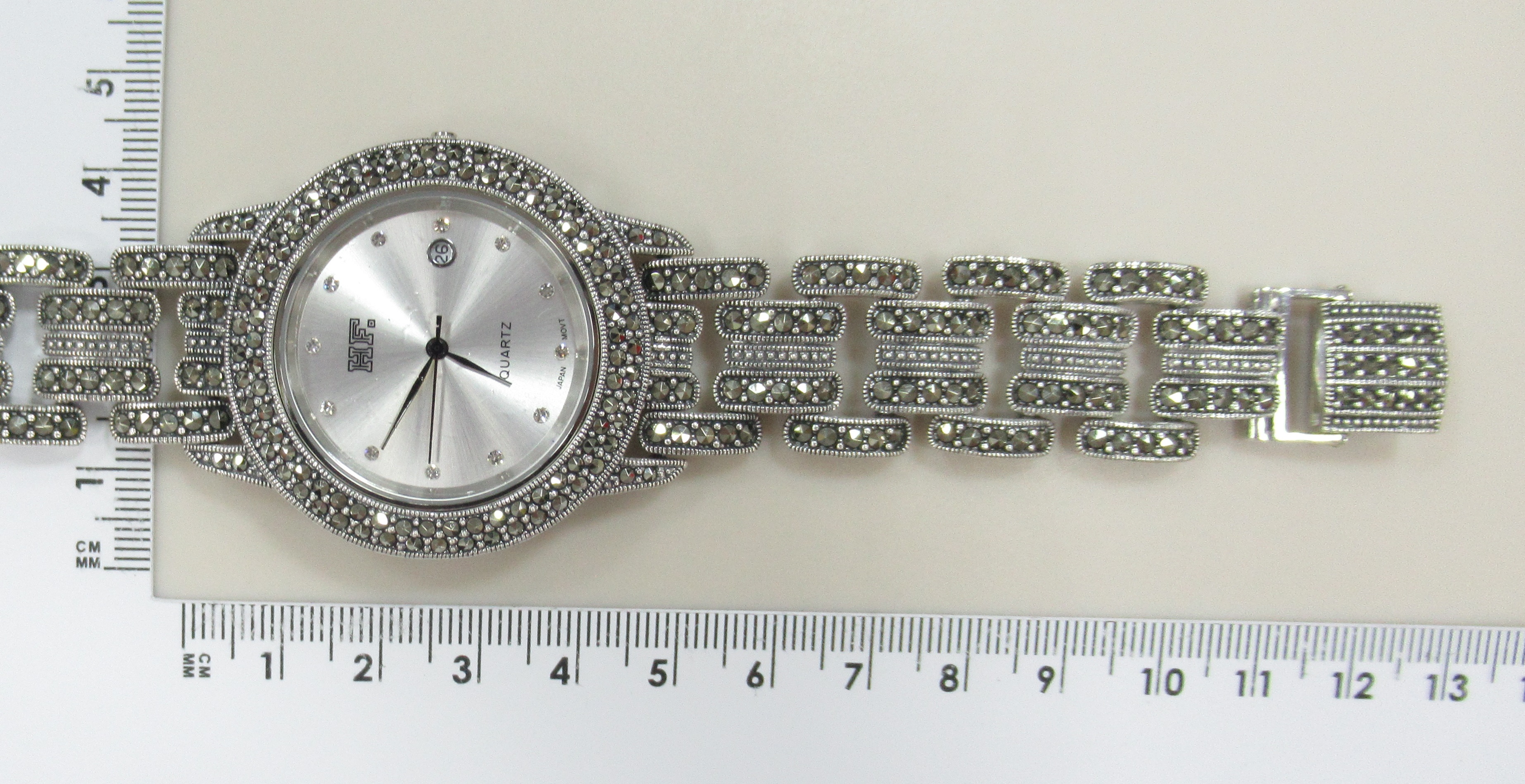 Серебряные часы с марказитами